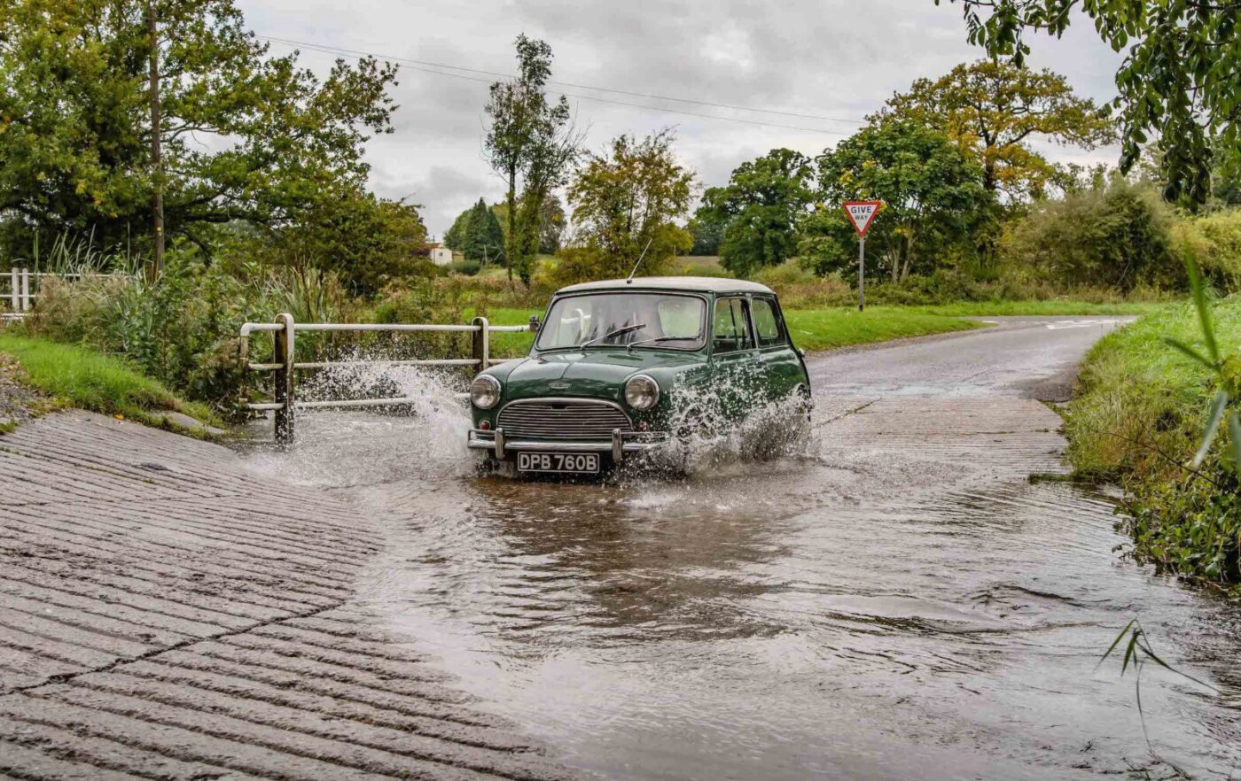 Mini Cooper splashing puddle