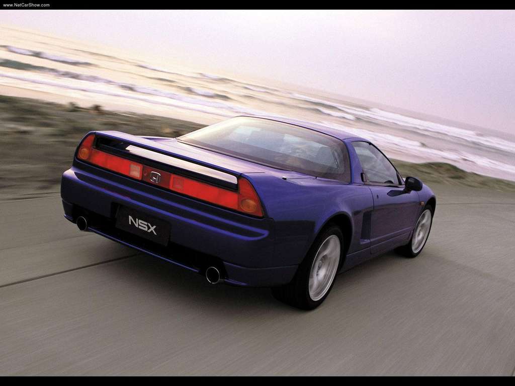 Honda-NSX_2002_1024x768_wallpaper_23 A blue Honda NSX driving by the beach
