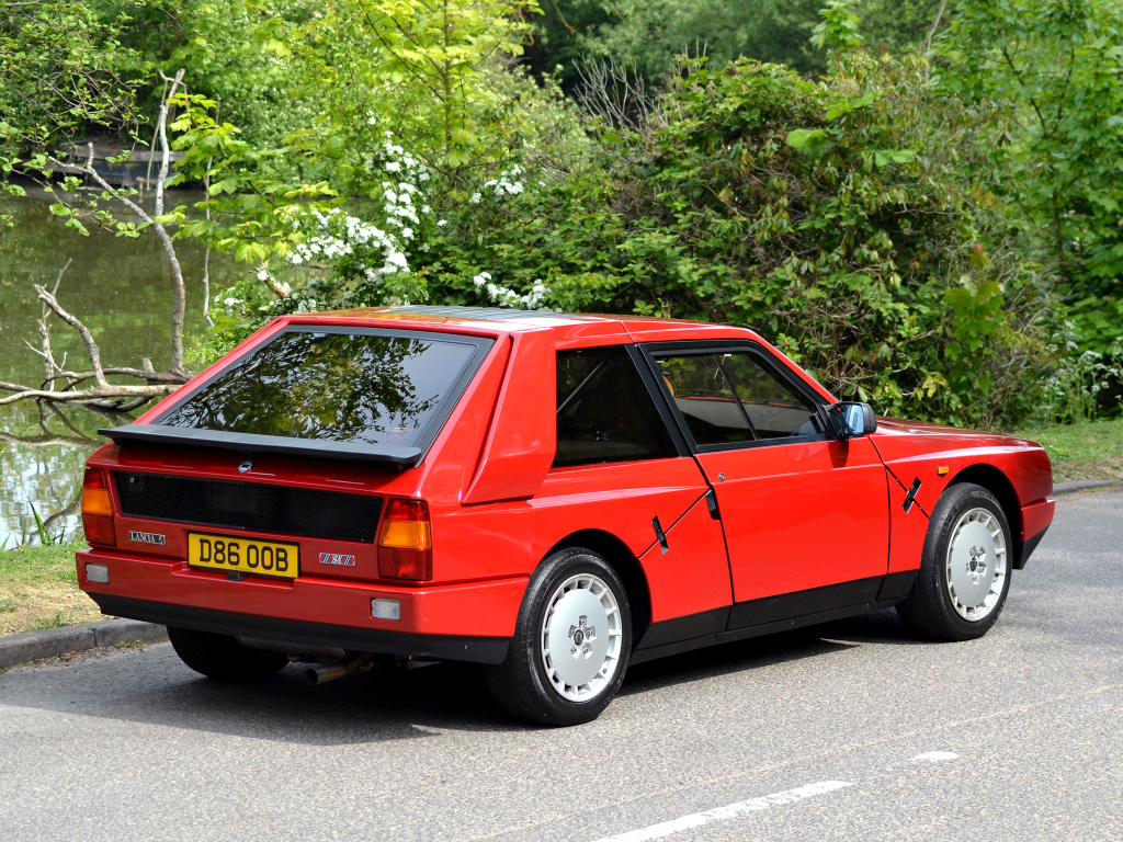 Red Lancia Delta S4 Stradale parked on the side of the road