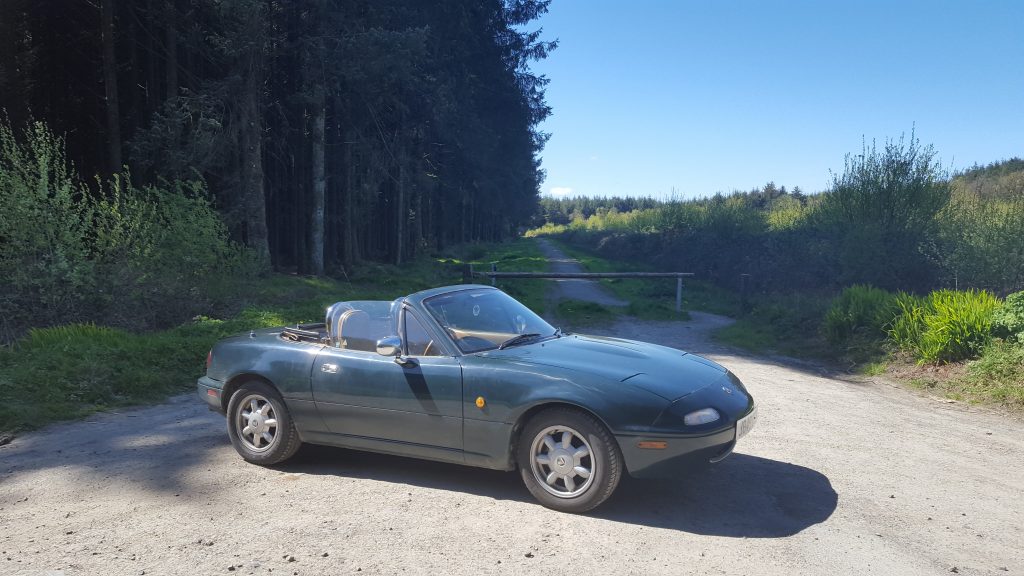 MX-5 Eunos Roadster parked outside in the sunshine
