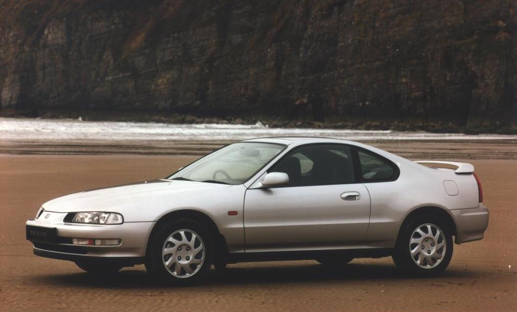 90s coupe on the beach