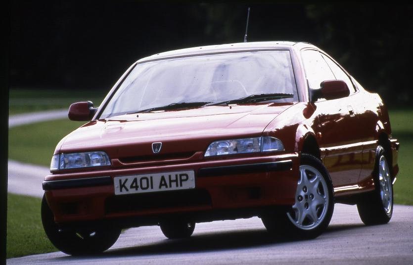90s coupe on the road