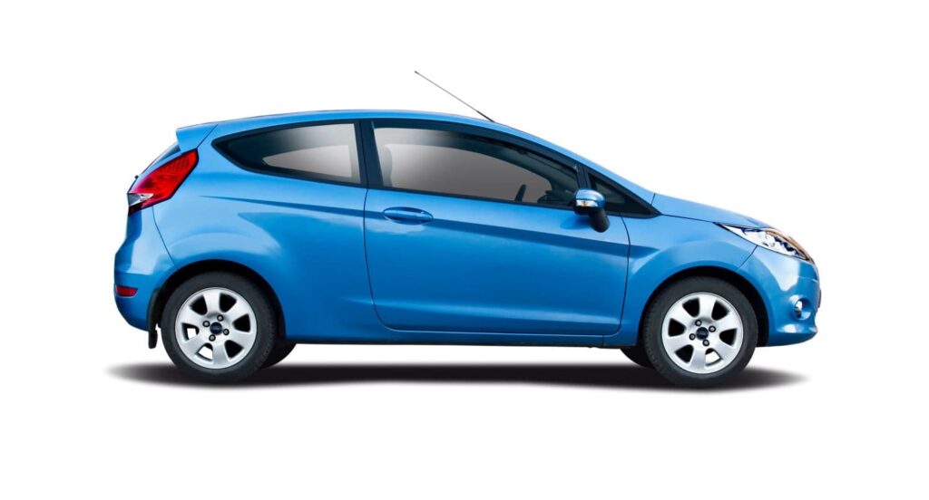 Blue Ford Fiesta on white background