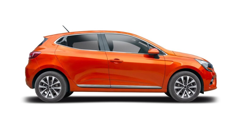 Orange Renault Clio on white background