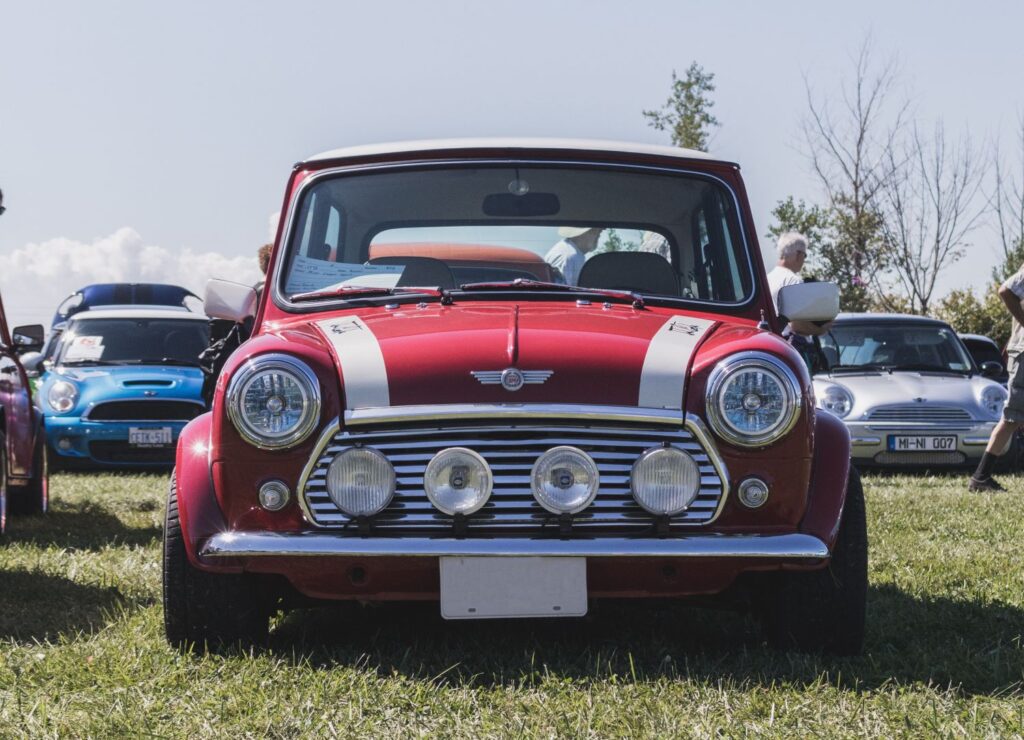 Modified red Mini on grass at a show