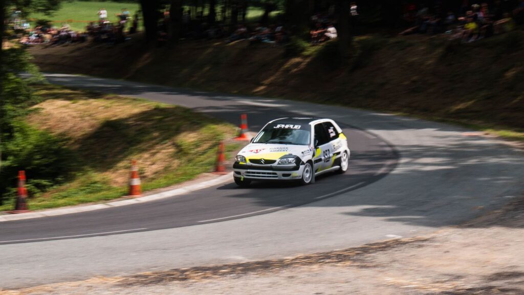 Citroen Saxo driving on road at an event