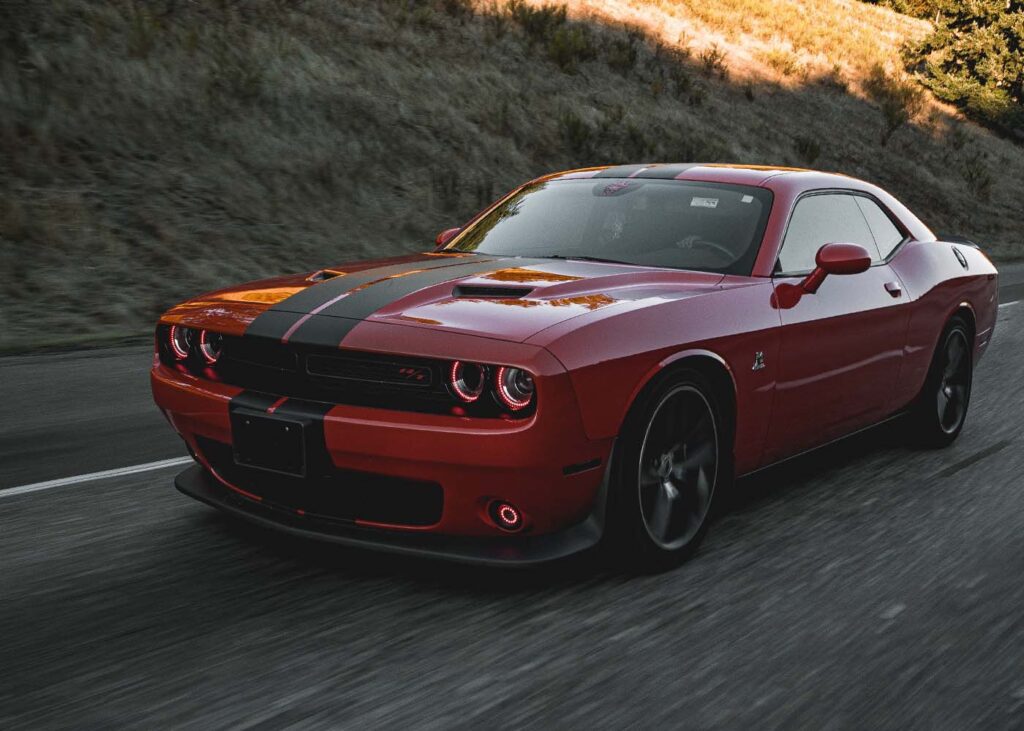 Dodge Challenger driving down road