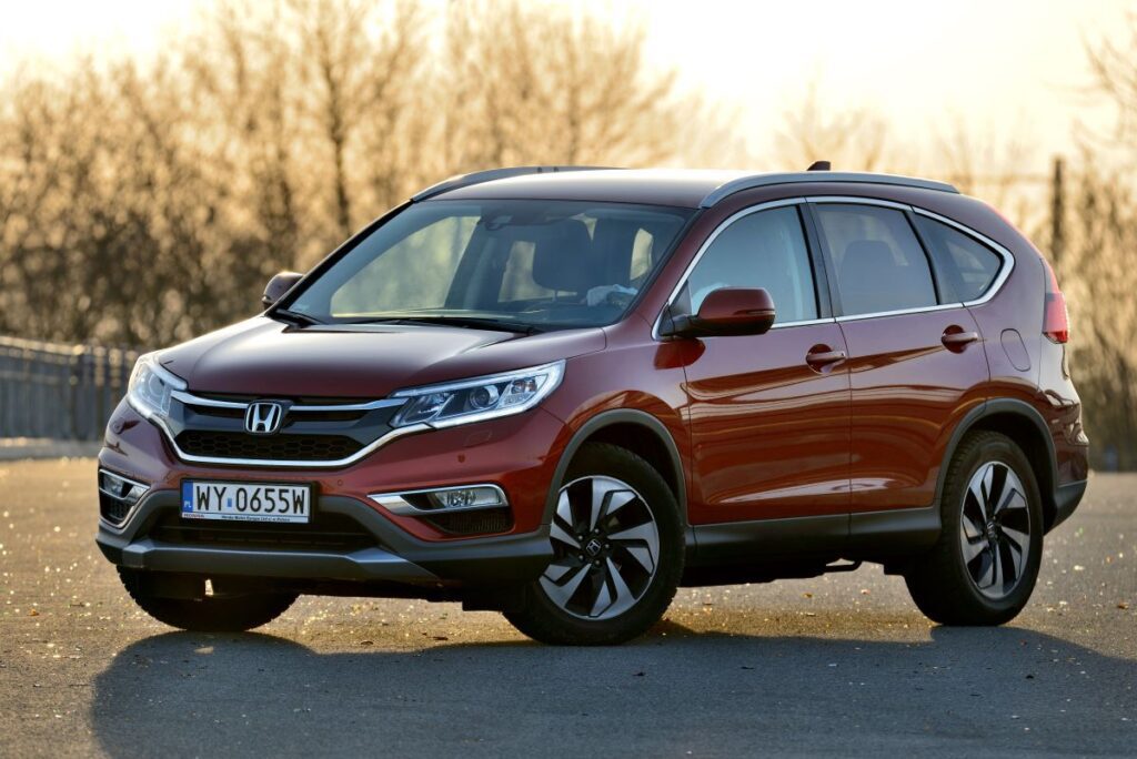 Honda CR-V parked with sun in background